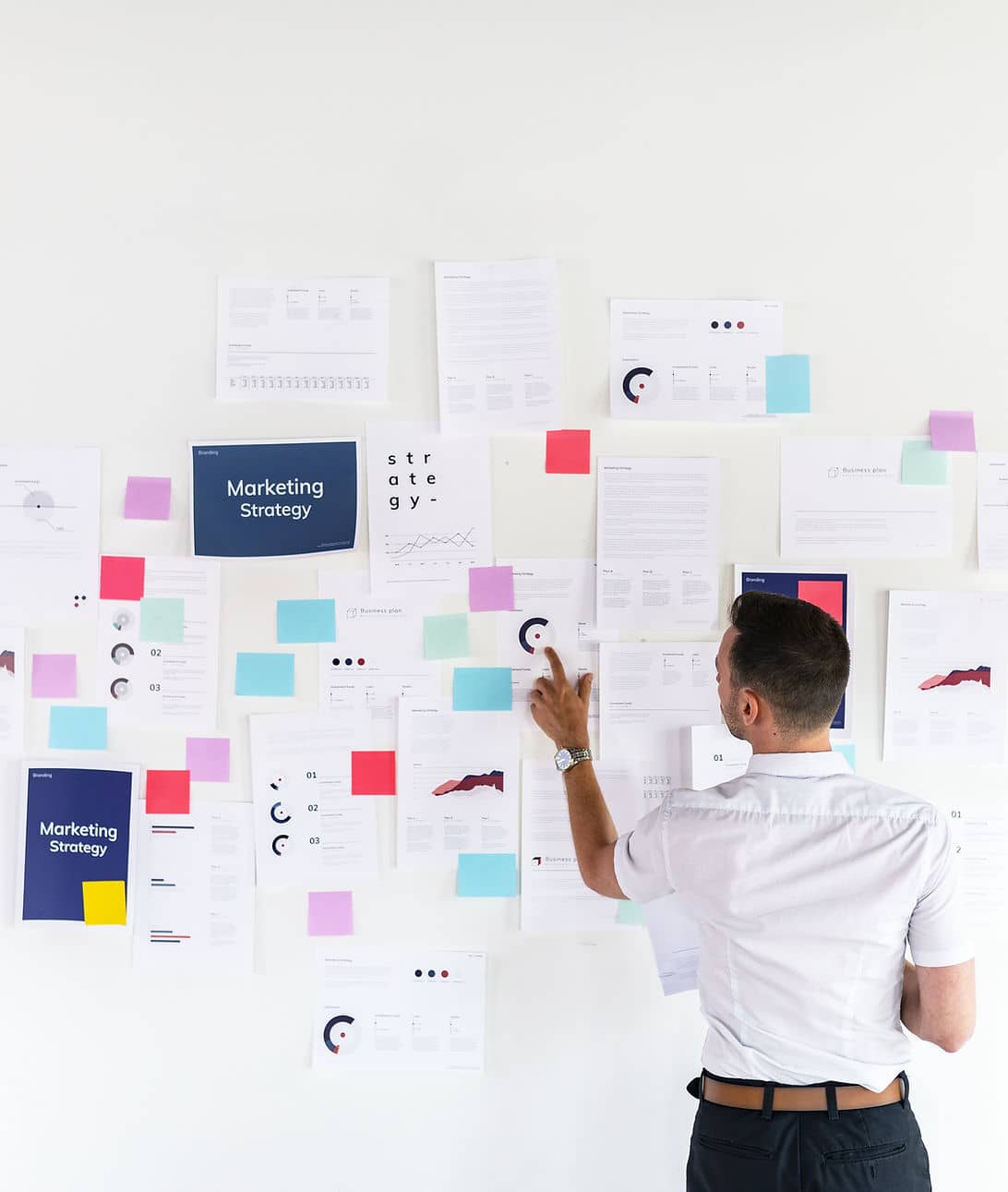 Businessman planning a digital marketing strategy on a white board